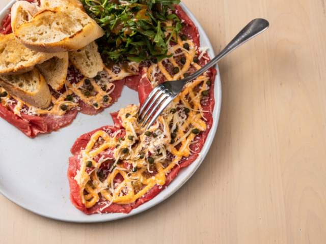 A Beef Carpaccio entrée from restaurant Fork & Plough in Greenville, SC.