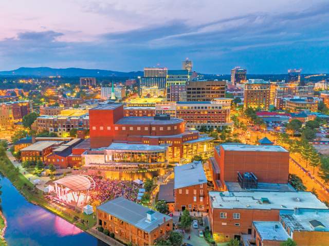 Aerial view of a city with bright lights