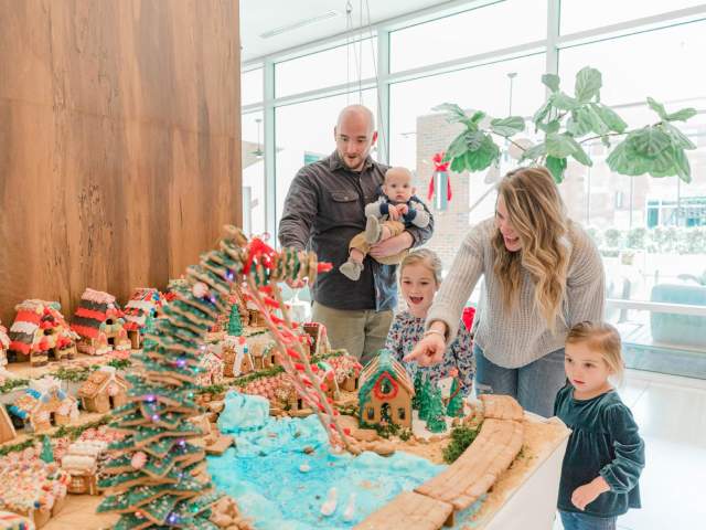 A family views a gingerbread contest exhibit in downtown Greenville, SC.