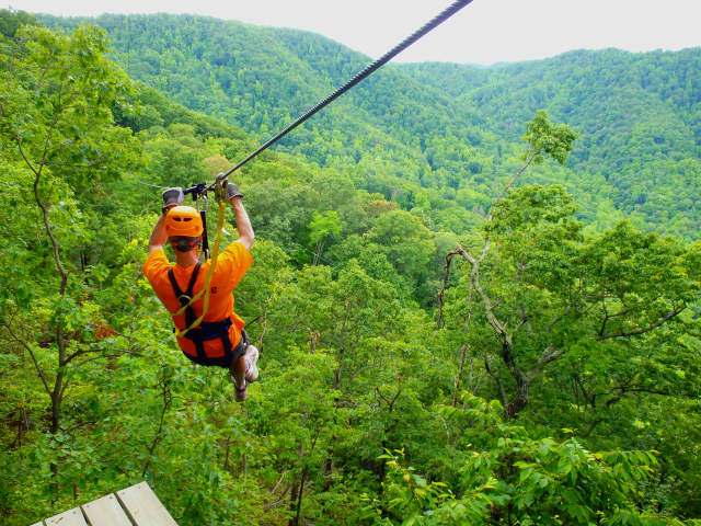 Man ziplining at The Gorge Zipline Canopy Tour