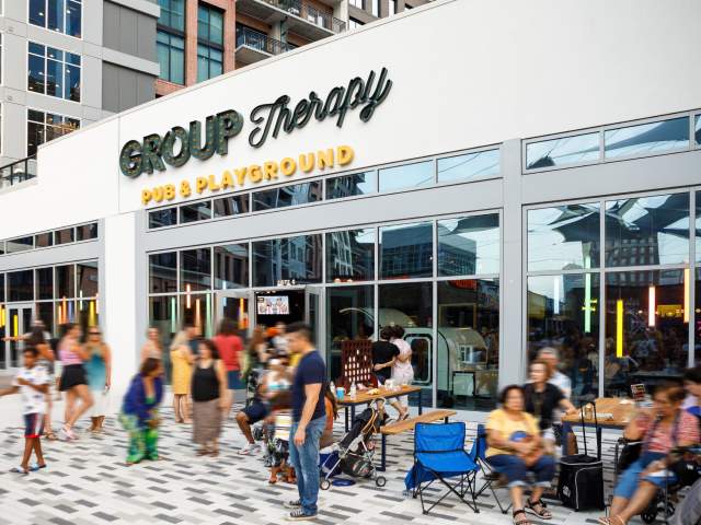 Group Therapy is a pub and playground offering experiential entertainment and the first and only indoor venue to offer a cocktail bar with a full food menu, an 18 hole wacky mini course, ice curling, ping pong, axe throwing, and tons of backyard games.