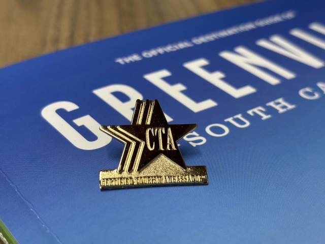 Certified Tourism Ambassador Pin. VGSC Guide in background