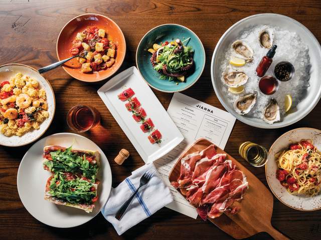 A delectable-looking table full of mouthwatering food at Jianna, an Italian restaurant in downtown Greenville, SC.
