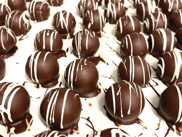 A sheet of chocolate truffles topped with white chocolate from LaRue Fine Chocolate in Greenville, SC.