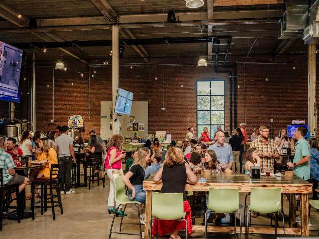 Families and friends having a great time at Magnetic South Brewery on the Westside of Greenville, SC.