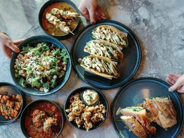A variety of Mediterranean-inspired cuisine on a table in Paloma in downtown Greenville, SC.