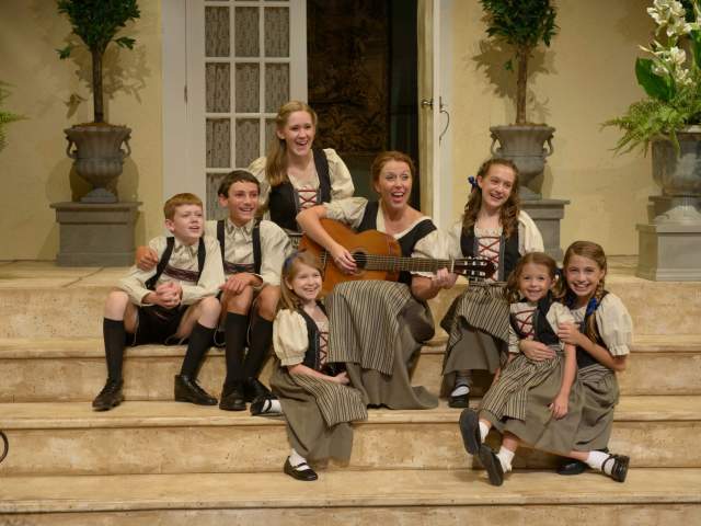 Singing on the steps of a house in "The Sound of Music" production by the South Carolina Children's Theatre in Greenville, SC.