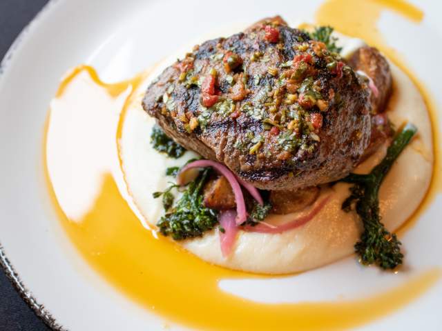 Steak dinner with potato puree and vegetables at Soby's New South Cuisine