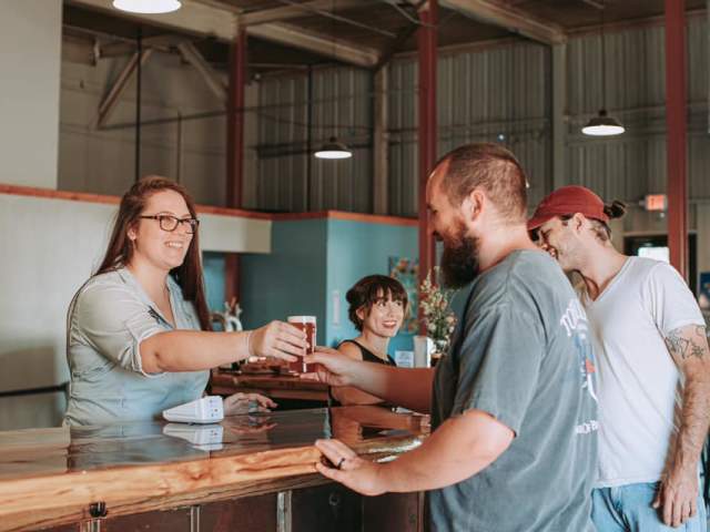 Men Buying Beer at Carolina Bauernhaus Greenville