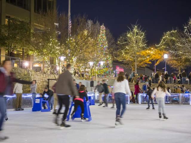 Patrons skate outdoors at the United Community Ice on Main rink in downtown Greenville, SC.