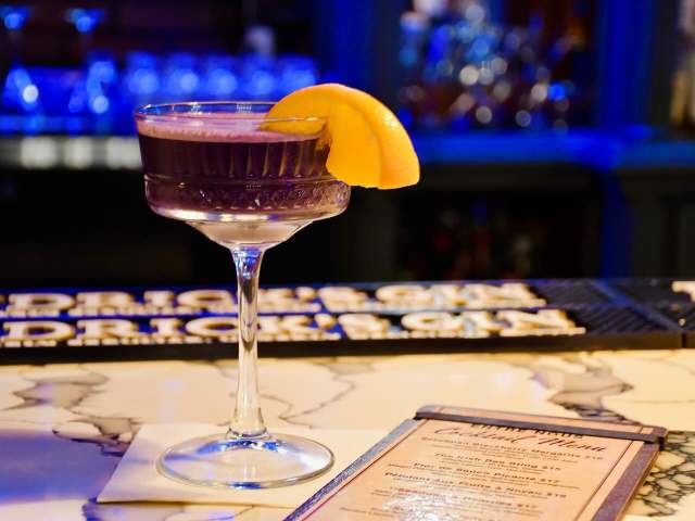 A purple punch daiquiri sits out on the counter of Entre Nous, a speakeasy in downtown Greenville, SC.