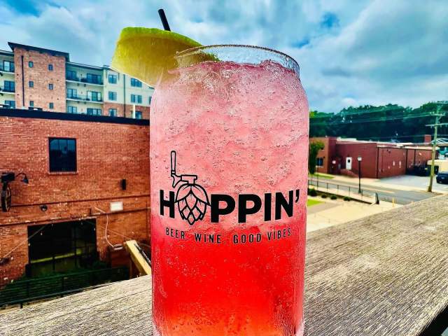 A pink cocktail looks appealing from the rooftop bar of Hoppin' GVL in downtown Greenville, SC.