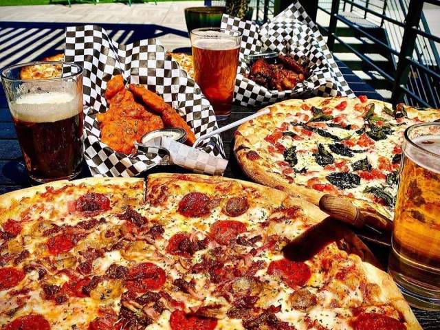 Deluxe pizzas beckon on the rooftop terrace of Hoppin' GVL in downtown Greenville, SC.