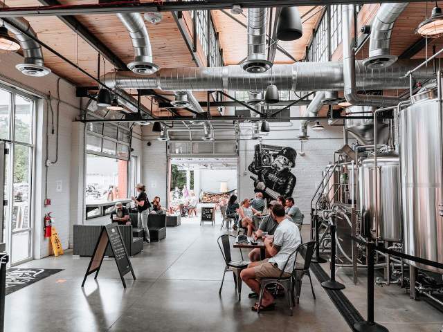 People sitting in Liability Brewing Co.