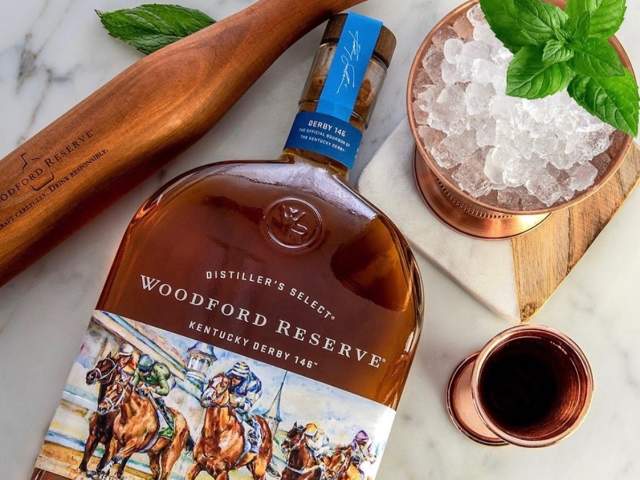 Woodford Reserve bourbon whiskey and ice sit on a counter at Neat Bourbon Bar in downtown Greenville, SC.