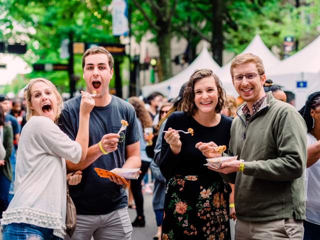 Two Couples eating and posing at Fall for Greenville 2018