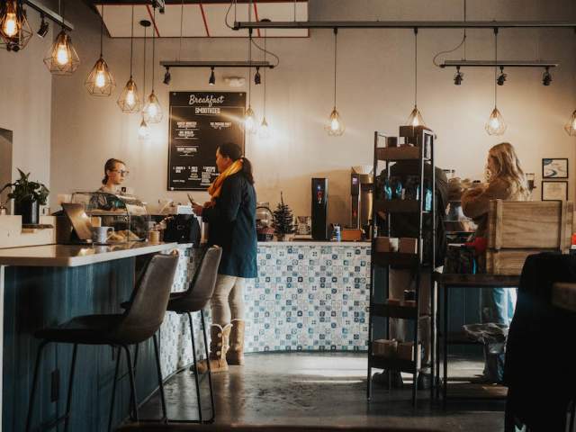 The cozy, well-lit interior of Unlocked Coffee Roasters in Greenville, SC.