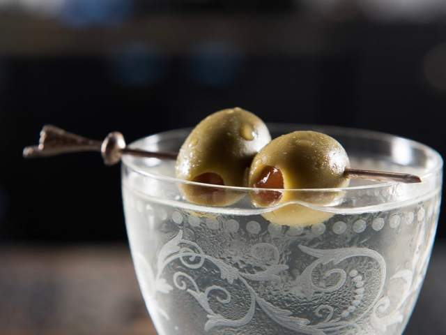 Two olives sit atop a dirty martini at speakeasy Vault & Vator in downtown Greeenville, SC.