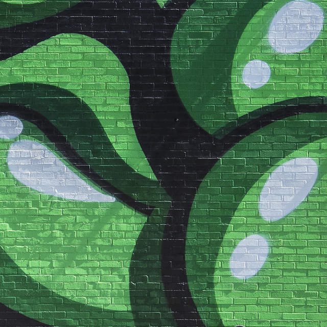 Green bubbles splash out a mural at Stone's Point in Greenville, SC.