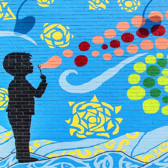 A colorful mural of a boy blowing bubbles in Mauldin, South Carolina.