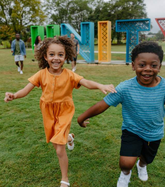 Kids run around in pure joy at Unity Park in downtown Greenville, SC.