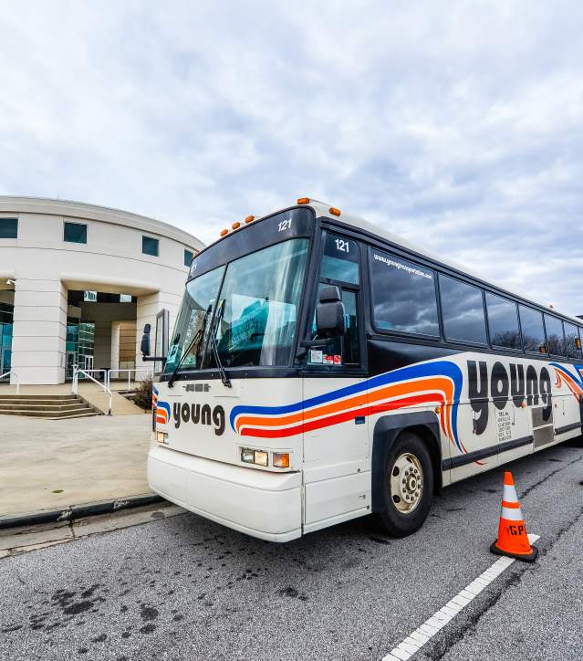 Young Transportation bus on the road in front of Bon Secours Wellness Arena.