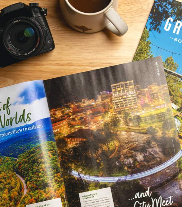 The 2025 Destination Guide splays open to an article on having the Best of Both Worlds (city and nature) in Greenville, SC.