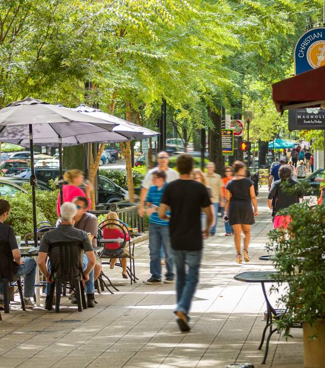 Outdoor dining and shopping on downtown Greenville’s quaint and charming Main Street.