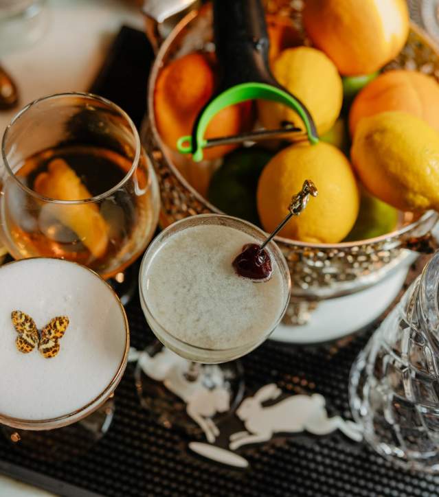 Cocktails on the counter with fruit at The Rabbit Hole in Greenville, SC.