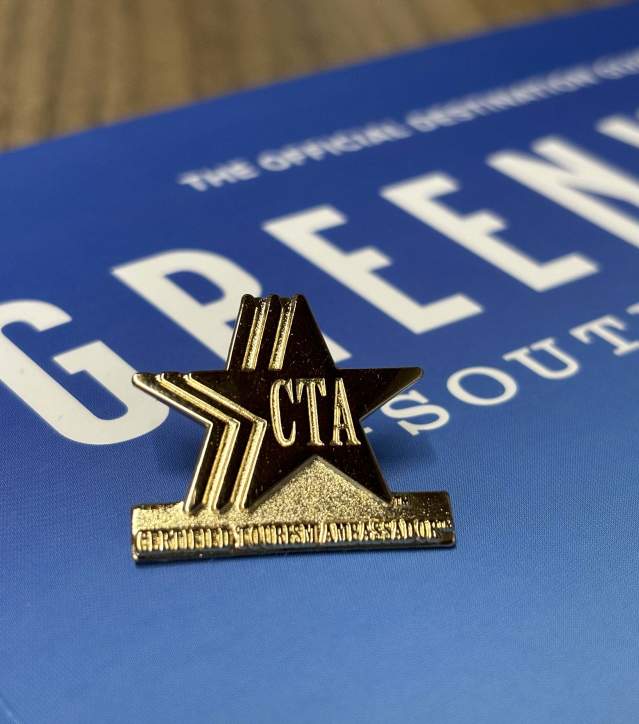 Certified Tourism Ambassador Pin. VGSC Guide in background