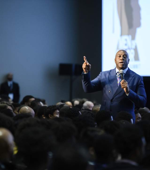 Magic Johnson talking to a crowd