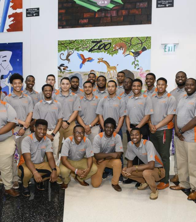 Men posing for the Men of Color Summit