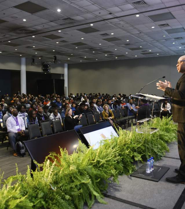 Speaker talking to audience at Men of Color National Summit
