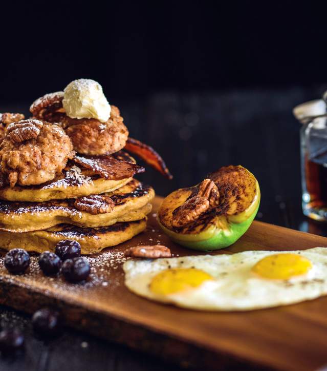 Shoo pancakes, sunny side up eggs, and fruit from Tupelo Honey café in Greenville, SC.