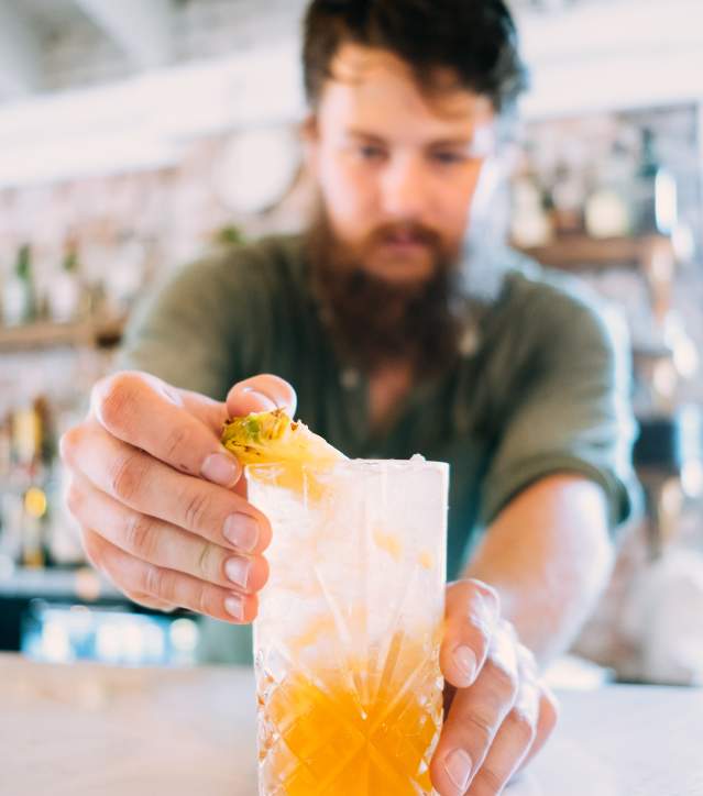 The Anchorage restaurant bartender making cocktail
