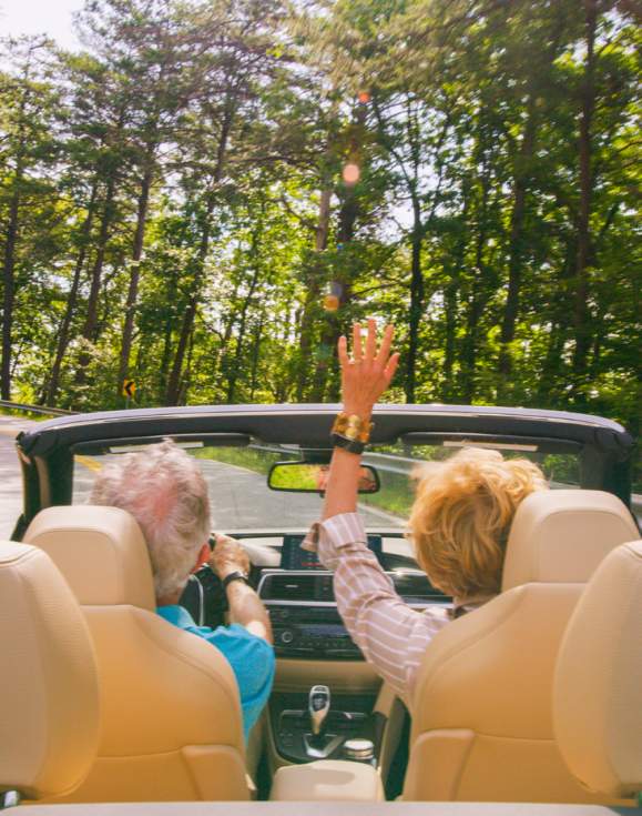 Couple driving up to Caesars Head in a Convertible