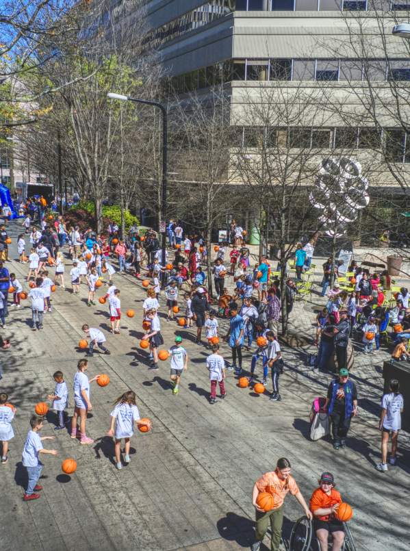 Downtown Dribble event in celebration of the SEC Women's Basketball tournament brings the Greenville community together to dribble down Main Street to the Bon Secours Wellness Arena.