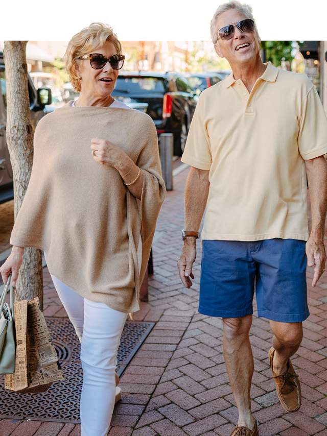 Senior couple walking on Main Street on a wonderful sunny day.