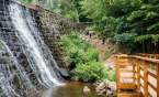 The waterfall dam at the end of Lake Placid at Paris Mountain State Park.