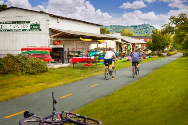 Exterior view of the Swamp Rabbit Trail in front of Sunrift Adventures shop.