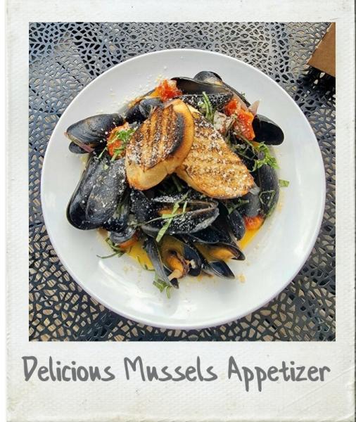 A Polaroid photograph of a mussels seafood appetizer from The Farehouse at Taylors Mill in Taylors, SC.