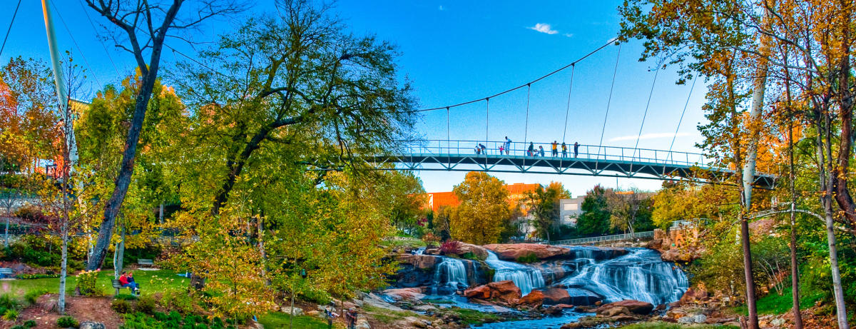 https://assets.simpleviewinc.com/sv-greenville/image/upload/c_limit%2Ch_1200%2Cq_75%2Cw_1200/v1/cms_resources/clients/greenville/Falls_Park_on_the_Reedy_featuring_the_Liberty_Bridge_1600x615_2__88aa2a1d-f028-4c9a-bcc3-ebb9bff7a723.jpg