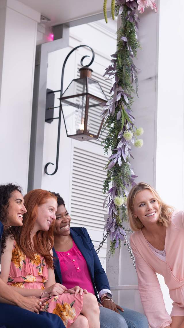 Guests taking a selfie outside The Cake Bake Shop.
