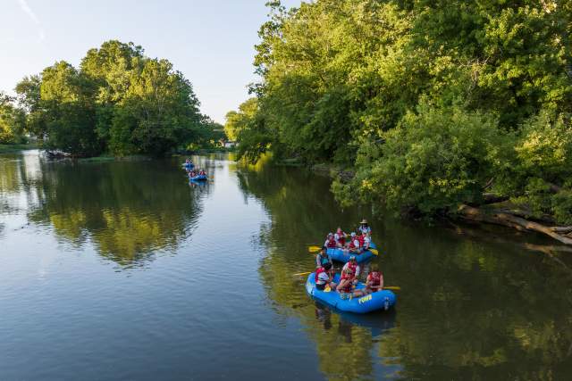 People kayaking on the White River for White River Light Up the Night.