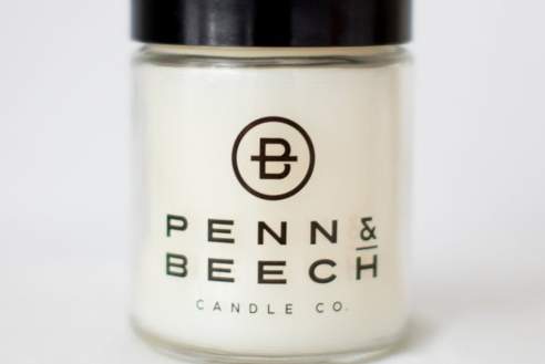 A Penn & Beech soy candle for the Holiday Adventure Pass.