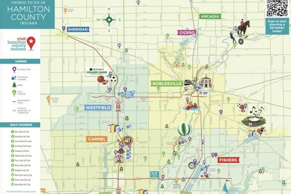 An illustrated map of Hamilton County showing roads, waterways, and towns, with colorful icons marking attractions and activities across the area. A legend and list of locations appear along the sides, and a QR code is displayed in the upper corner.