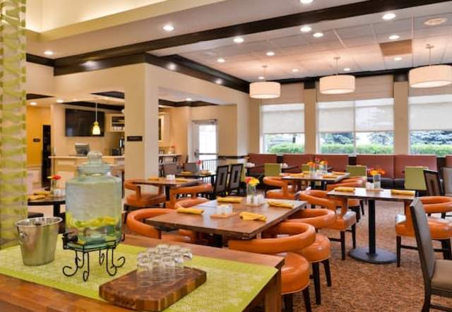 interior of Hilton Garden Inn with tables set up for restaurant seating