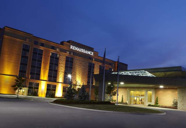 Renaissance Hotel Indianapolis North illuminated at night near the main entrance.
