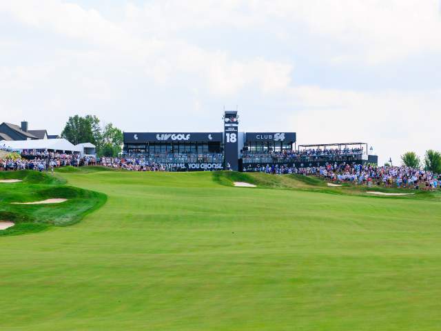 Wide view of the LIV Golf tournament course with grandstands and manicured fairways.