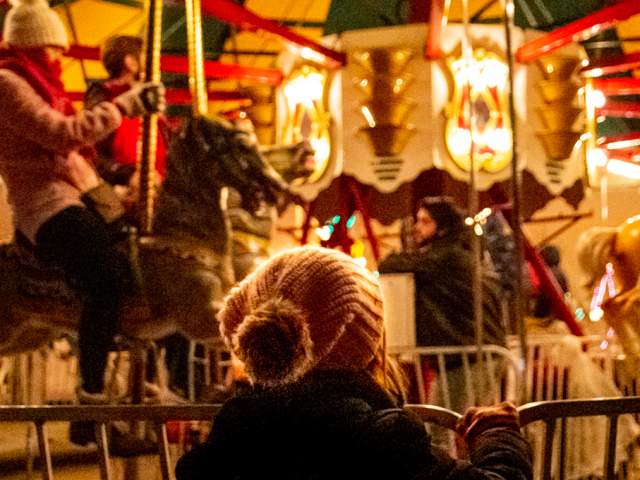 Kids on carousel horses
